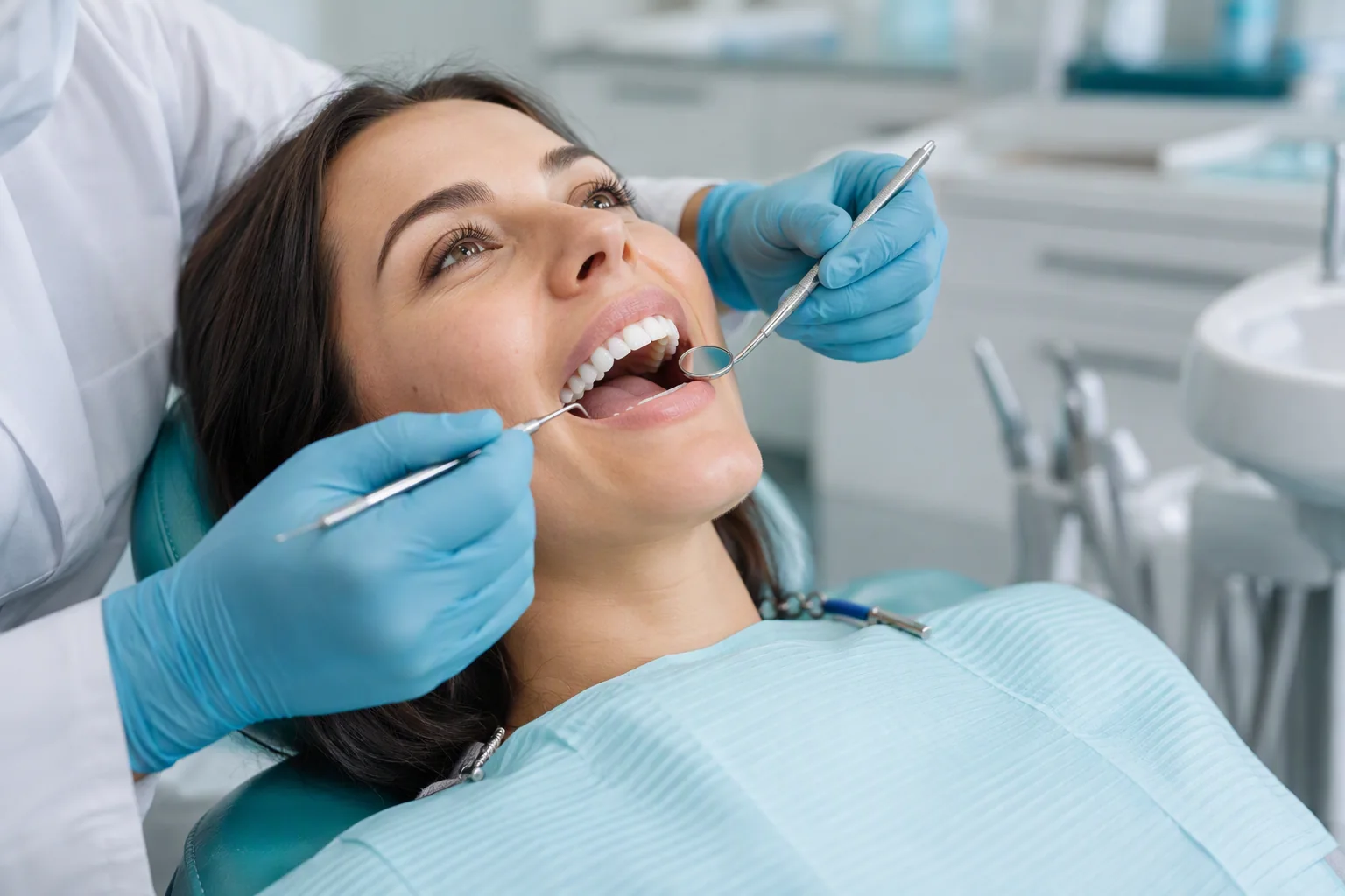 Dentist in gloves carrying out a routine dental exam at TrueNorth Dental in Kansas City